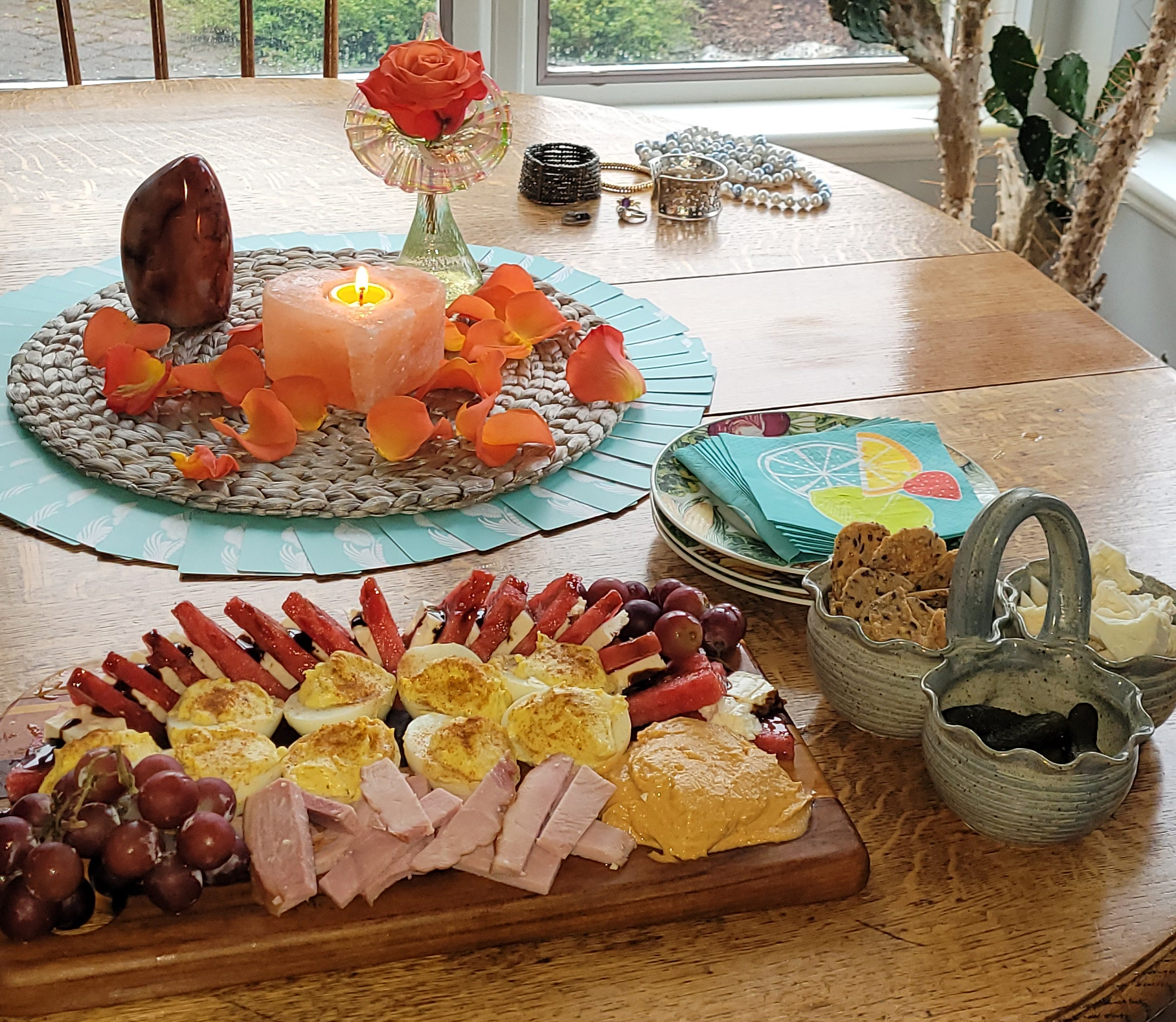 Charcuterie board on classic wood table in sunny kitchen